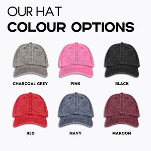 May include: Six different colour options for a baseball cap. The colours are charcoal grey, pink, black, red, navy, and maroon.
