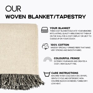 May include: A woven blanket or tapestry with a cream-colored body and a black and cream fringe. The text on the image reads "Our Woven Blanket/Tapestry". The blanket is made of 100% cotton and has colorful fringe.