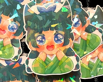 以下が含まれることがあります： 緑色の髪、大きな目、緑と白の衣装を着た漫画のキャラクターが描かれた、虹色のステッカー4枚セット。キャラクターは笑顔で、ハート型の口をしています。