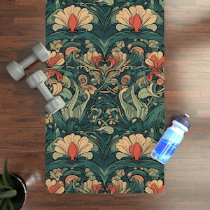 May include: A yoga mat with a floral pattern in shades of green, red, and cream. The mat has a detailed design with intricate swirls and leaves.