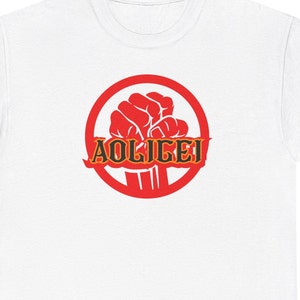 Puede incluir: Un círculo rojo con un puño levantado dentro y la palabra "AOLIGEI" escrita en negro con contornos naranjas.