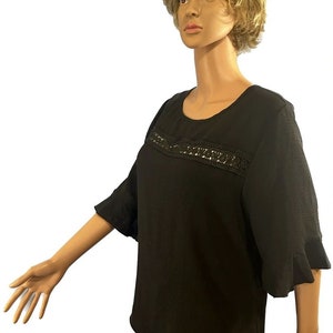 Size 14 blouse, quarter sleeve.
