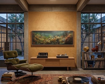 May include: A long rectangular framed landscape painting featuring a dark, moody underwater scene with coral and seaweed, mounted on a textured ochre wall above a light wood media console, a green lounge chair, and a vinyl record collection.