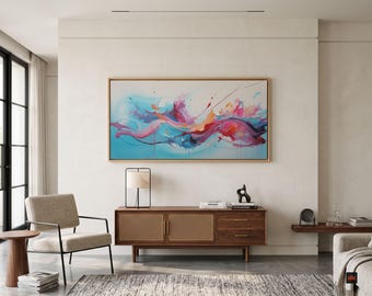 May include: A rectangular wall art piece featuring an abstract painting with vibrant swirls of blue, pink, orange, and purple paint strokes, enclosed in a light-colored wooden frame, mounted above a wooden sideboard with cane cabinet doors.