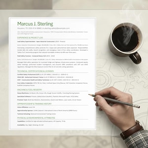 May include: A resume with the name "Marcus J. Sterling" is displayed on a light background. A cup of coffee and a hand holding a pencil are also visible. The resume includes sections for experience, certifications, and skills.