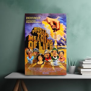 May include: A framed poster for the film "Monty Python's The Meaning of Life." The artwork shows a hand with a corkscrew above a bottle, with the film's title prominently displayed. The poster also features the film's cast.