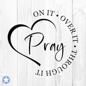 May include: Black and white graphic design with a heart shape and the text "Pray" inside the heart. The text around the heart reads "On it. Over it. Through it."