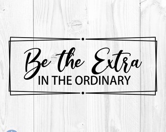 May include: Black and white typography on a white wood background with a double black frame. The text reads "Be the Extra in the Ordinary."