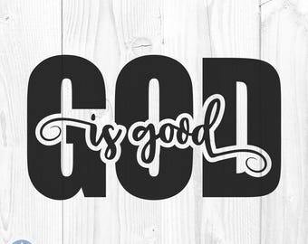 May include: Black and white graphic design with the words "GOD is good" in a bold, stylized font. The text is set against a white, wood-grain background, creating a striking contrast. The phrase is written in a mix of block letters and elegant script.