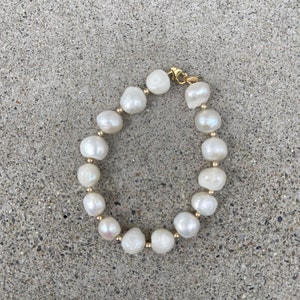 Elegant statement bracelet made of preloved freshwater pearls and gold-filled beads.