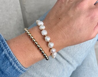 Elegant statement bracelet made of preloved freshwater pearls and gold filled pearls.