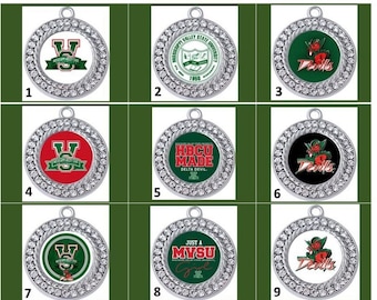 May include: Nine silver charms with rhinestones, each featuring a different design related to Mississippi Valley State University. The designs include the university's logo, the words "HBCU Made", and the mascot, the Delta Devils.