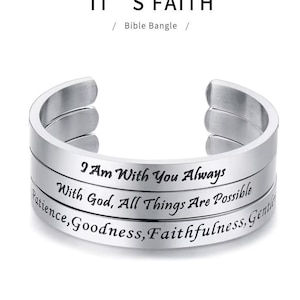 May include: A silver-colored Bible bangle with three bands, each engraved with inspirational phrases. The top band reads "I Am With You Always." The middle band says "With God, All Things Are Possible." The bottom band reads "Patience, Goodness, Faithfulness, Gently."