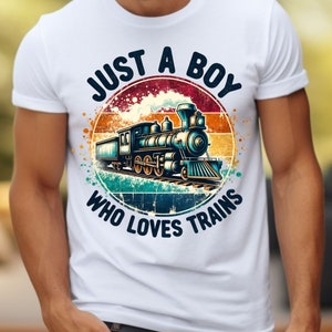 May include: White t-shirt with a vintage-style graphic of a train with the text "Just a Boy Who Loves Trains".