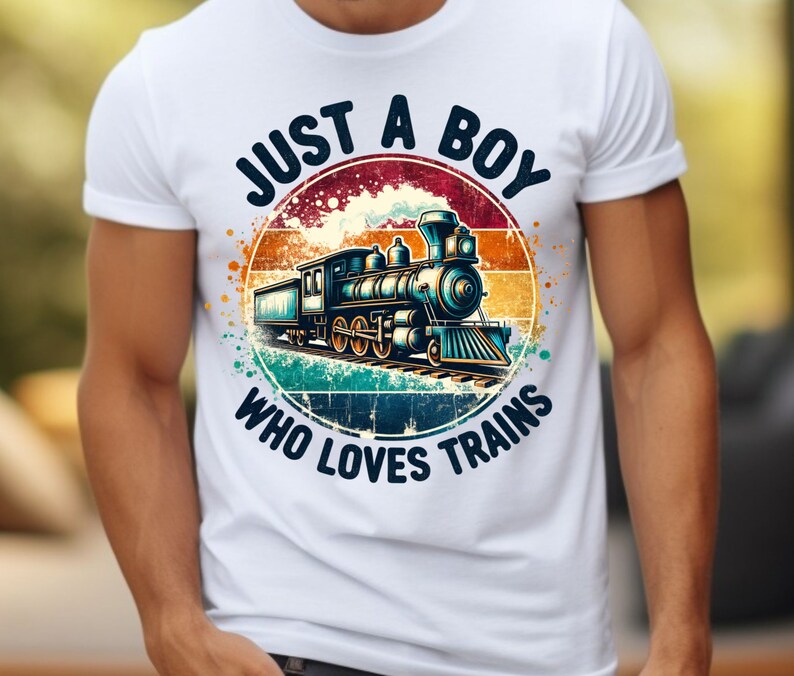 May include: White t-shirt with a vintage-style graphic of a train with the text "Just a Boy Who Loves Trains".
