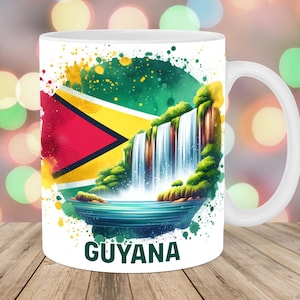 May include: White ceramic mug featuring the flag of Guyana and a watercolor illustration of a waterfall. The word "GUYANA" is printed in black at the bottom of the mug. The mug has a white handle.