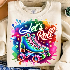 May include: A white sweatshirt with a colorful graphic of roller skates and the text "Let's Roll".