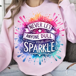 May include: Pink sweatshirt with a watercolour design featuring the text "Never let anyone dull your sparkle".