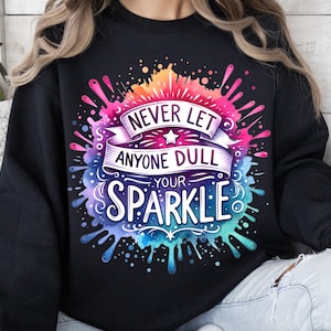 May include: Black sweatshirt with a colourful watercolour design that says "Never let anyone dull your sparkle."