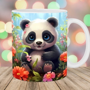 May include: White ceramic mug featuring a colourful illustration of a panda bear sitting in a field of flowers. The panda has black eyes and a pink nose.