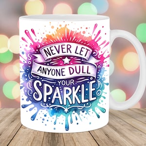 Puede incluir: Taza de café de cerámica blanca con un diseño de acuarela colorido y el texto "Nunca dejes que nadie apague tu brillo".