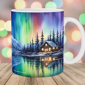 May include: White ceramic mug featuring a colourful image of a cabin in the woods with its reflection in a lake. The sky is filled with a vibrant aurora borealis.