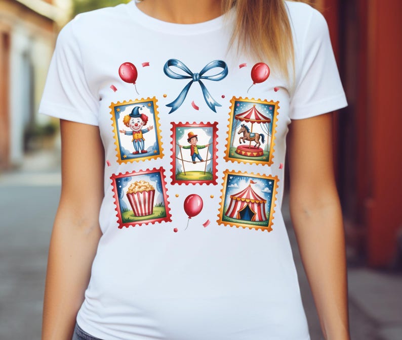May include: White t-shirt featuring colorful circus-themed postage stamp designs. The stamps depict a clown, tightrope walker, carousel, popcorn, and a circus tent. A blue bow and red balloons add to the festive design.