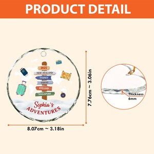 May include: A clear, round ornament with a travel theme, featuring a suitcase, passport, and camera illustrations. The ornament has a diameter of 3.18 inches and a thickness of 6mm. It includes the text "Sophia's Adventures" and destination signs.