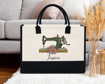 May include: A black and white tote bag with a green vintage sewing machine and pink flowers. The bag has a black handle and the name "Jessica" is printed on the front.