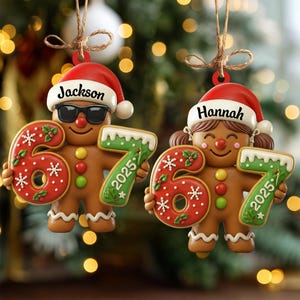 May include: Two gingerbread man Christmas ornaments. One wears sunglasses and a Santa hat with the name "Jackson". The other has pigtails and a Santa hat with the name "Hannah". Each holds a "67" and "2025" in green and red.