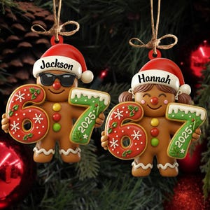 May include: Two gingerbread man Christmas ornaments. One wears sunglasses and a Santa hat with the name "Jackson". The other has pigtails and a Santa hat with the name "Hannah". Each holds a "67" with "2025".
