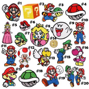 May include: A selection of twenty colourful embroidered patches featuring characters and symbols from the Super Mario video game series. Includes Mario, Luigi, Princess Peach, Bowser, and other iconic elements.
