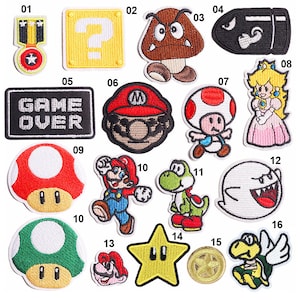 May include: A selection of embroidered patches depicting characters and symbols from a well-known video game. Includes a question mark, a mushroom, a star, and characters such as Mario, Yoshi, and Princess Peach. The patches are brightly coloured and detailed.
