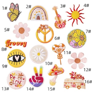 May include: A selection of embroidered patches with a retro theme. Designs include a butterfly, rainbow, guitar, sun, daisy, peace sign, eye, mushroom, and a van. The words "Groovy" and "Peace Love" are also featured.