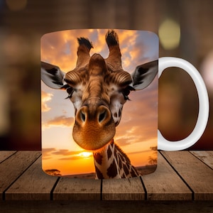 May include: White ceramic mug with a colorful image of a giraffe's face against a sunset background.