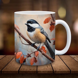 May include: White ceramic mug with a colorful illustration of a black-capped chickadee perched on a branch with autumn leaves.