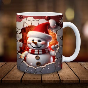 May include: White ceramic mug with a festive design featuring a smiling snowman wearing a red Santa hat and scarf, peeking out of a cracked brick wall.