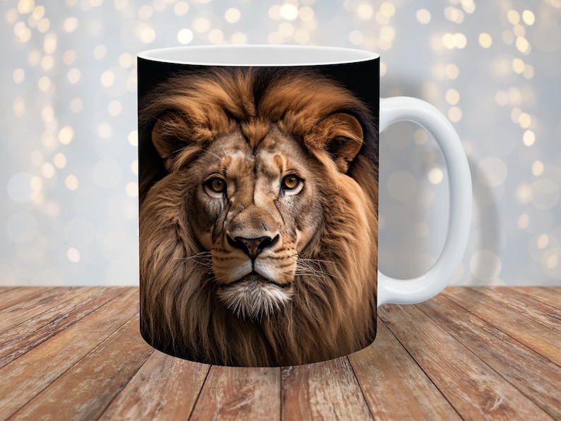 May include: White ceramic mug with a close-up image of a lion's face. The lion has a thick mane of brown and gold fur.