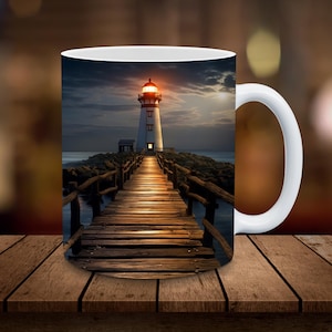 May include: White ceramic mug with a lighthouse and wooden walkway image. The lighthouse is white with a red roof and a light on top. The walkway is made of wooden planks and leads to the lighthouse.