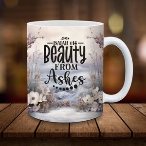 May include: White ceramic mug with a wintery scene and the text "Isaiah 6:14 - beauty from ashes" printed on it.
