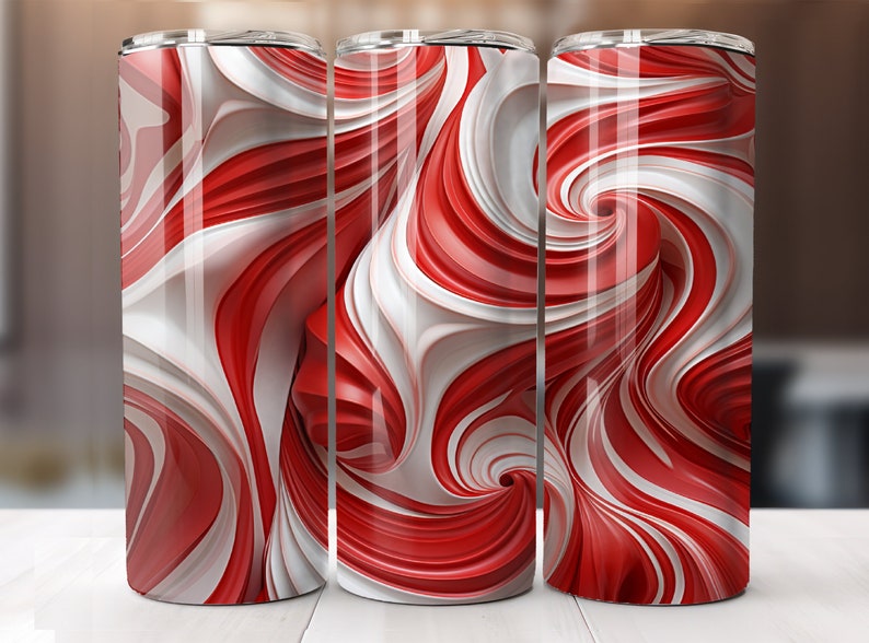 May include: Three stainless steel tumblers with a red and white swirling pattern. The pattern resembles candy canes.