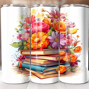 May include: A white tumbler with a colorful floral design and a stack of books. The flowers are pink, orange, yellow, and purple. The books are red, brown, blue, and yellow.