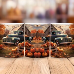 May include: White ceramic mug featuring a fall scene with a vintage green pickup truck, pumpkins, and a barn. The design includes orange and brown autumn leaves, creating a seasonal theme. The mug has a white handle.
