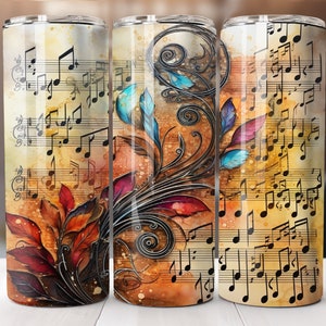 May include: A stainless steel tumbler with a colorful floral design and musical notes on a watercolor background. The tumbler is perfect for holding hot or cold beverages.