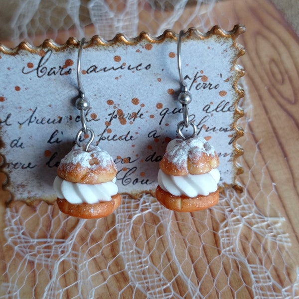 Cream puff dangling earrings in polymer clay.