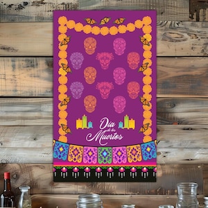 May include: A Day of the Dead themed print on a purple background. The print features colorful sugar skulls, butterflies, candles, and decorative banners. The text "Dia de los Muertos" is written in white script.