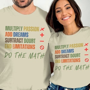 May include: Two beige t-shirts with a motivational message printed on them. The message reads: "Multiply Passion x Add Dreams Subtract Doubt End Limitations - Do The Math".