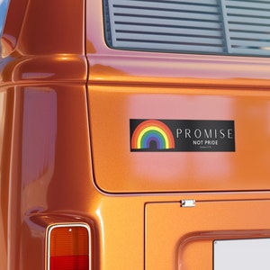 May include: A black and white sticker with a rainbow and the text "PROMISE NOT PRIDE Genesis 9:13" on a orange vehicle.