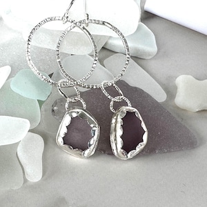 Hand made genuine sea glass dangle earrings.  Sterling silver, sea glass earrings/handmade earrings. Purple/lavender sea glass earrings