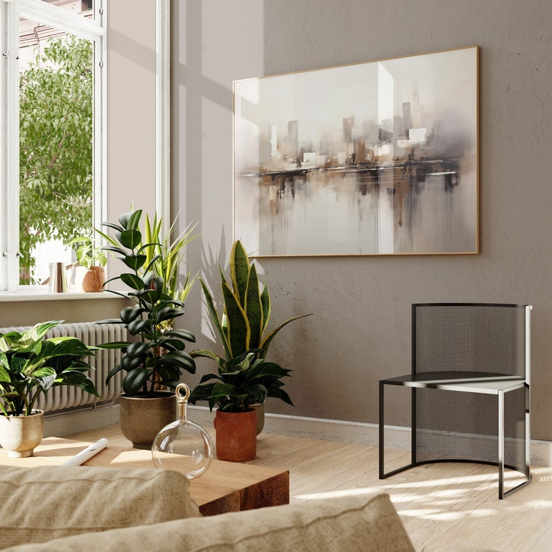 May include: A living room interior with a modern chair, a large abstract painting, and several houseplants. The painting is in shades of brown and gray and depicts a cityscape. The chair is black metal with a mesh back and seat. The plants are in terracotta and ceramic pots.